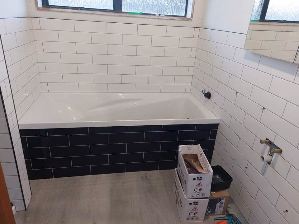 Whakatāne bathroom renovation with walk-in shower and deeper bath by Bay Construction