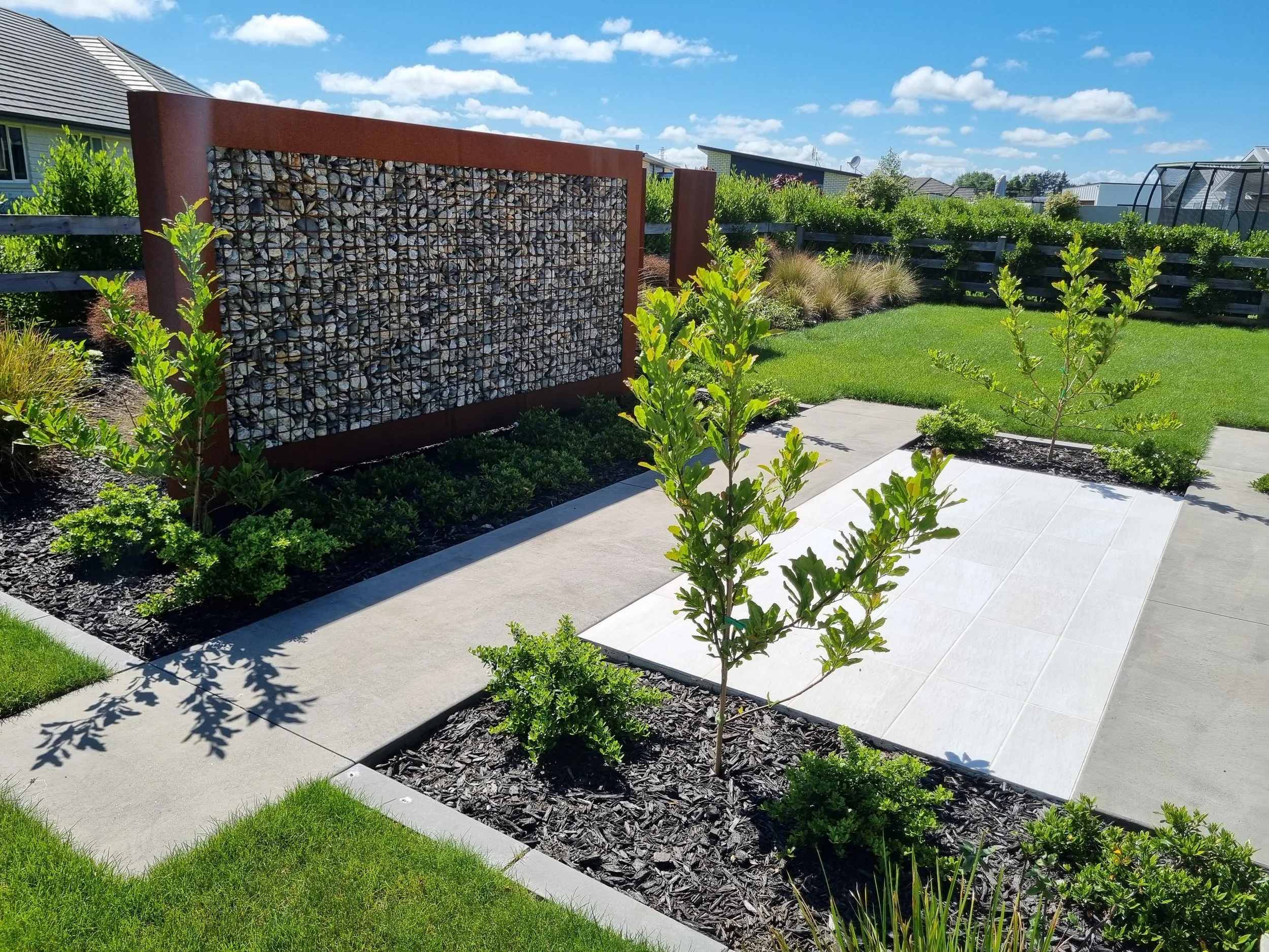 Residential landscape installation of Gabion walls Hamilton