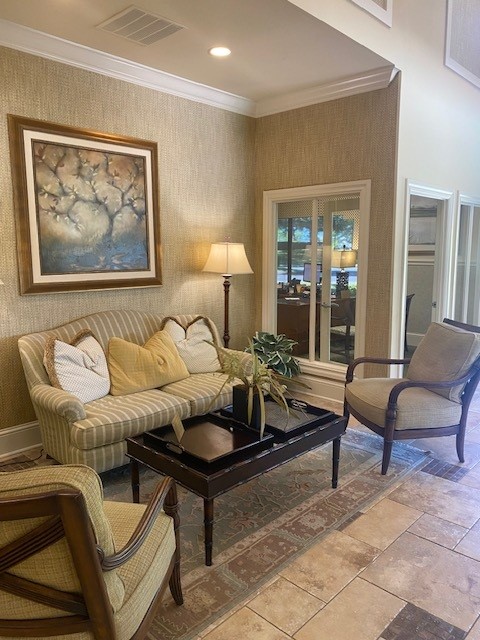 Clubhouse lounge interior with seating area at The Quarters Apartment Homes