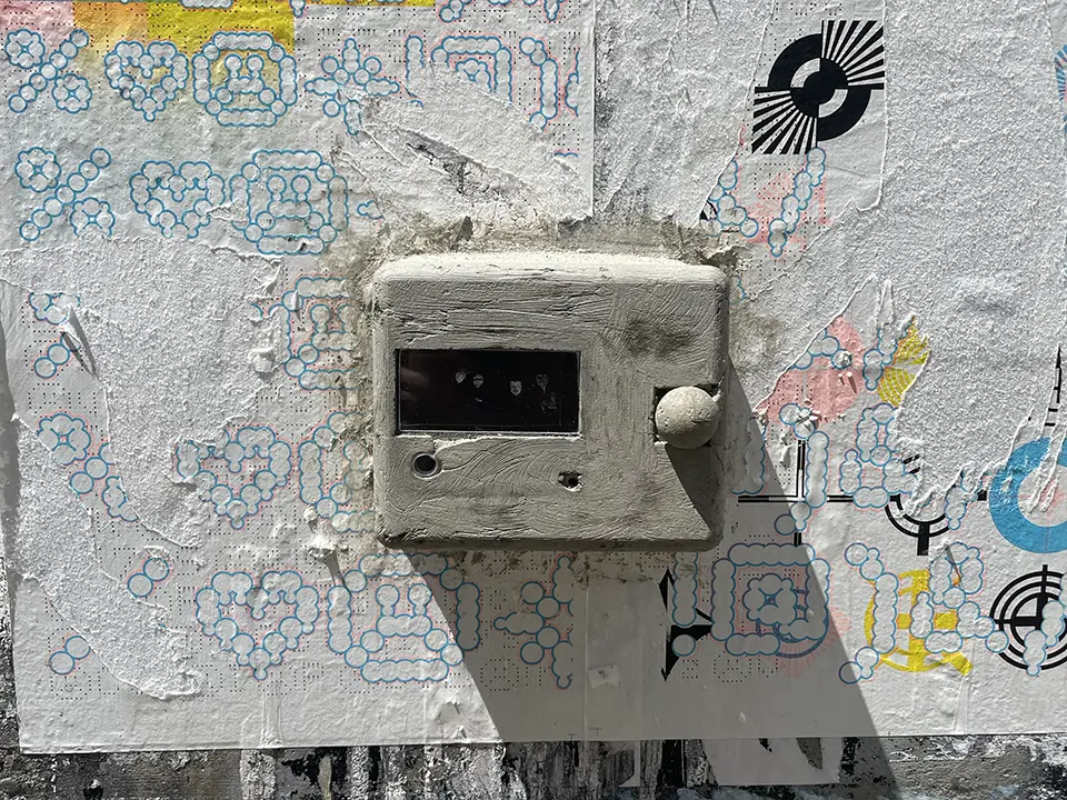 Interactive surveillance installation in public space displaying participant images