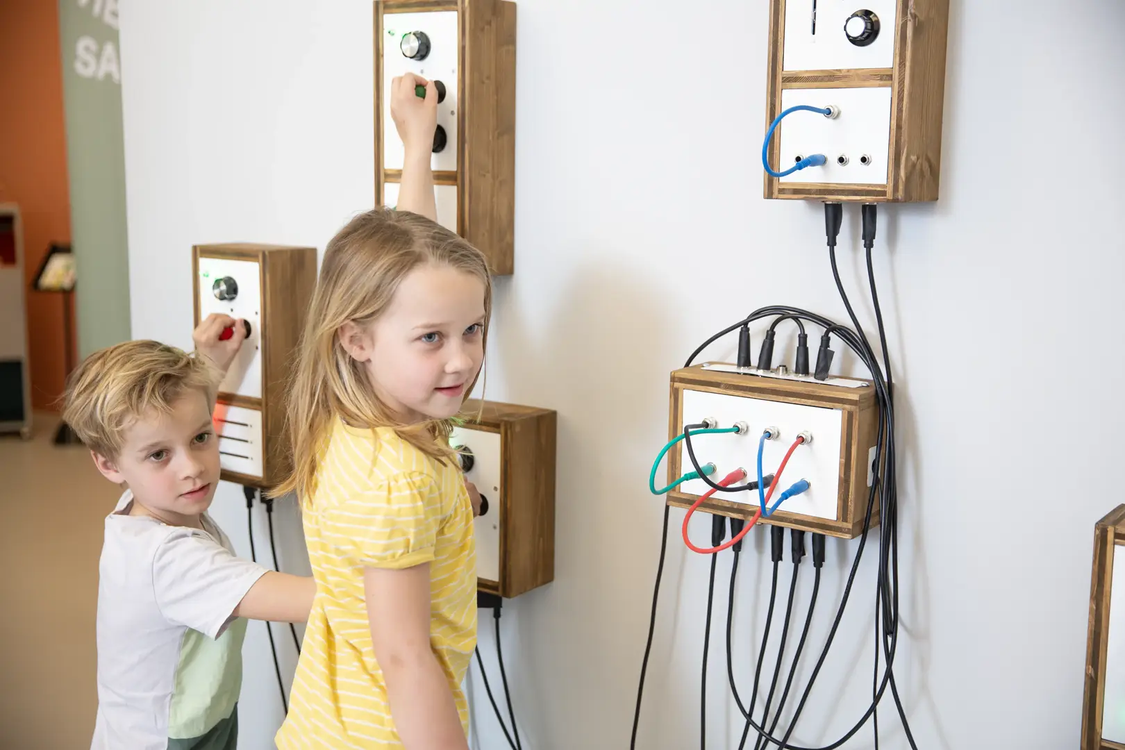 Children interacting with tactile museum installation