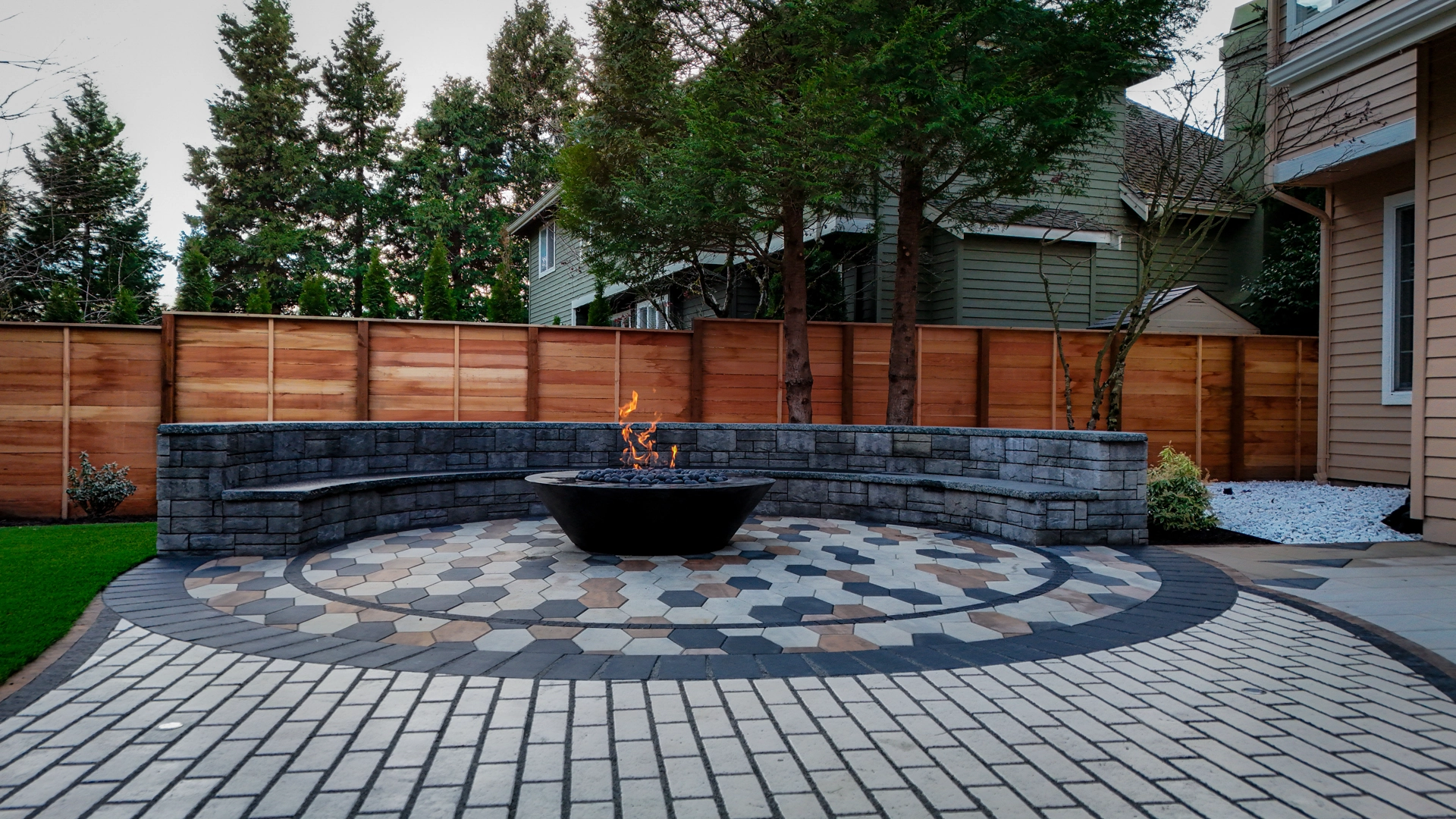 A top-view of a finished landscaping project in Greater Seattle with hot tub and outdoor kitchen