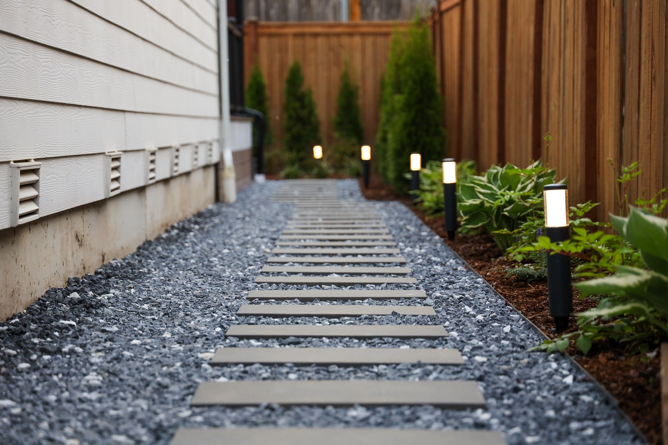 A custom-built pathway leading to a property's patio