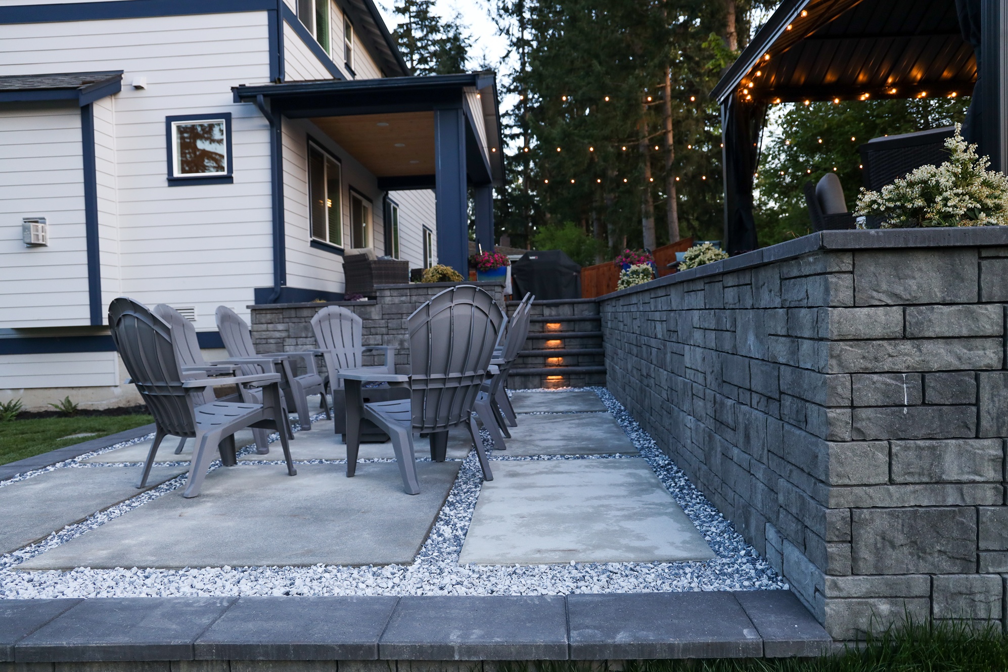 A recreation area built for accommodating guests with hardscaped pavement