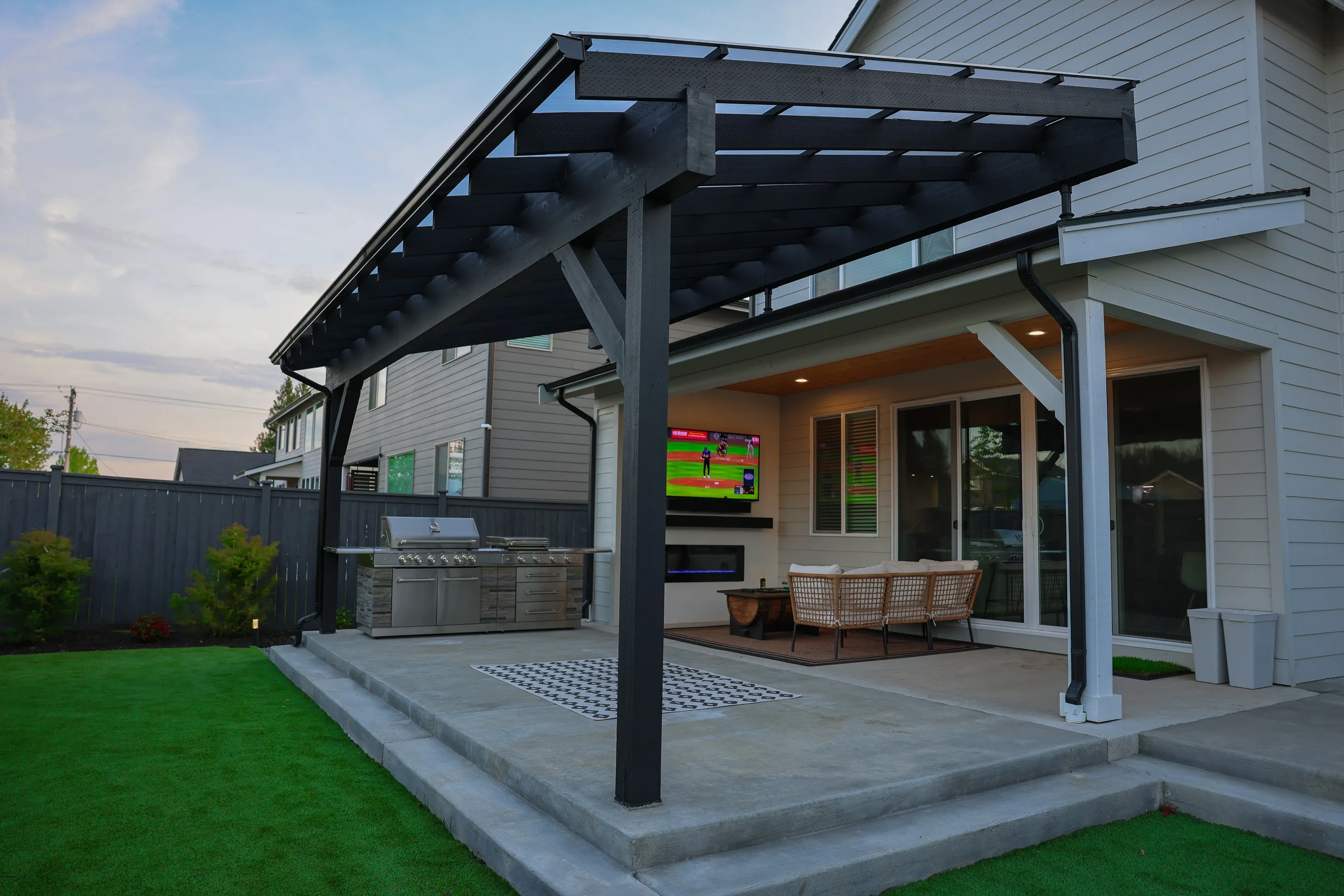 Backyard remodel with outdoor kitchen and entertainment area in Greater Seattle
