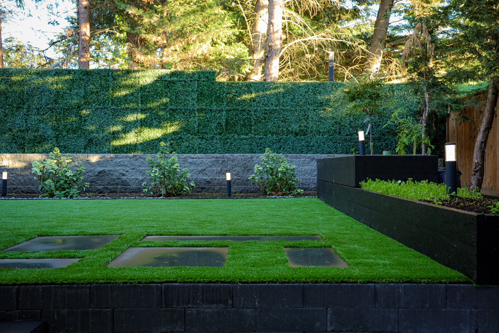 Backyard landscape design in Seattle with shrubs