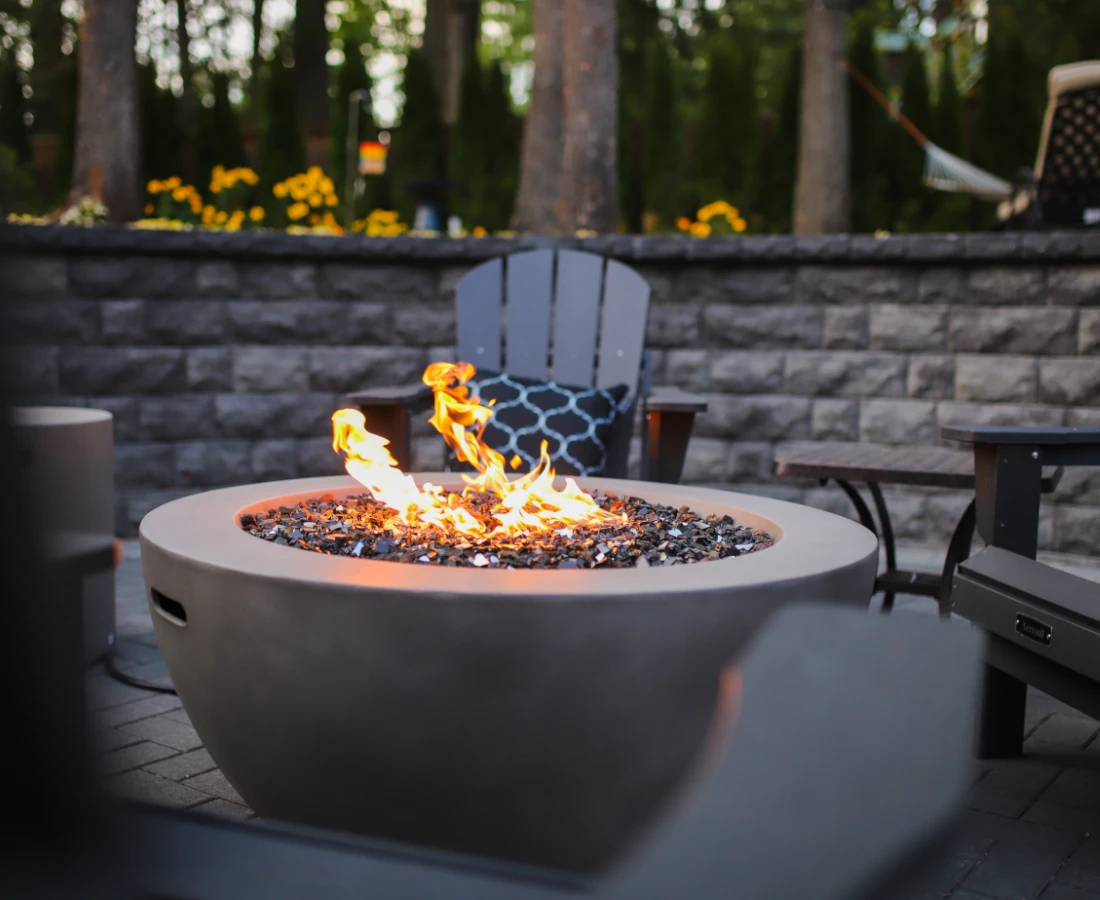 Fire pit in Seattle with retaining wall in the background