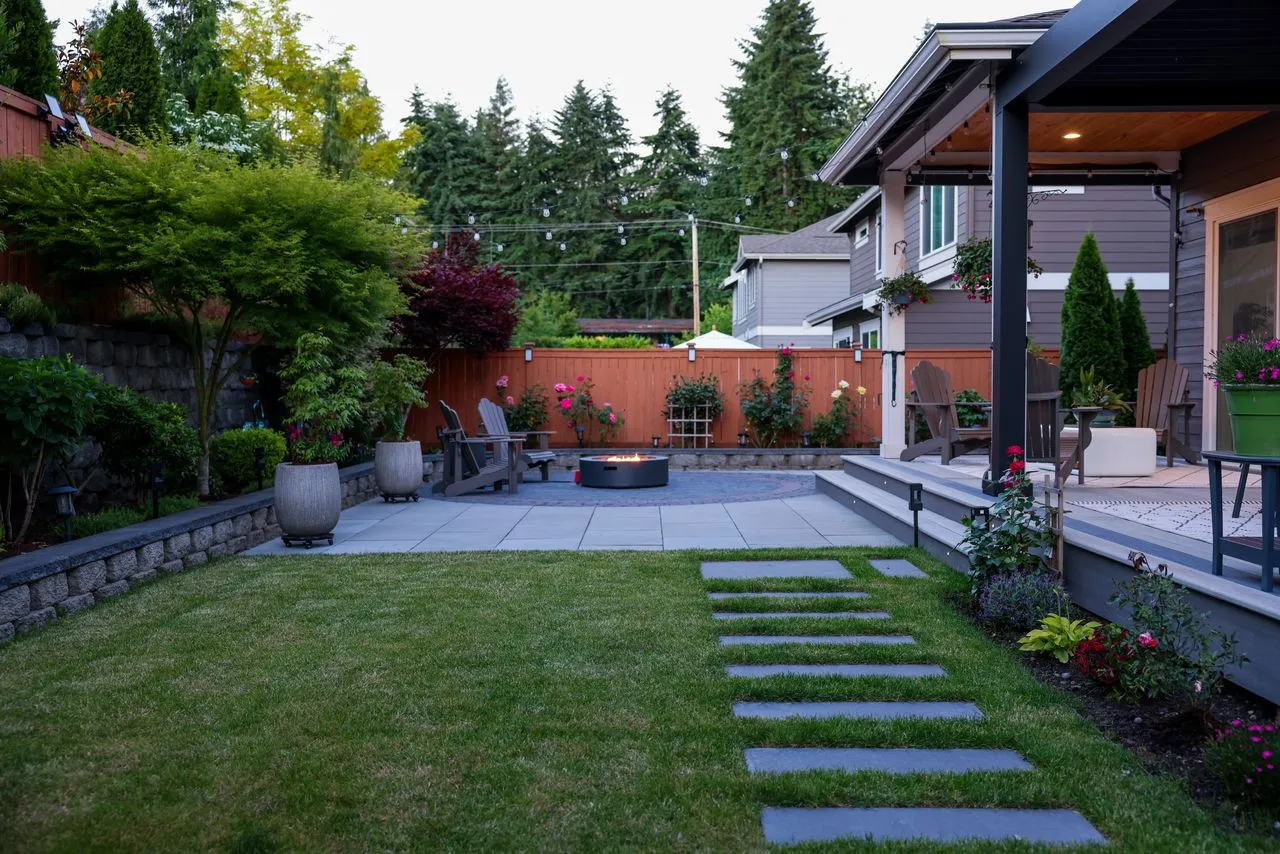 Backyard landscaping project in Auburn with potted plants near recreation area 