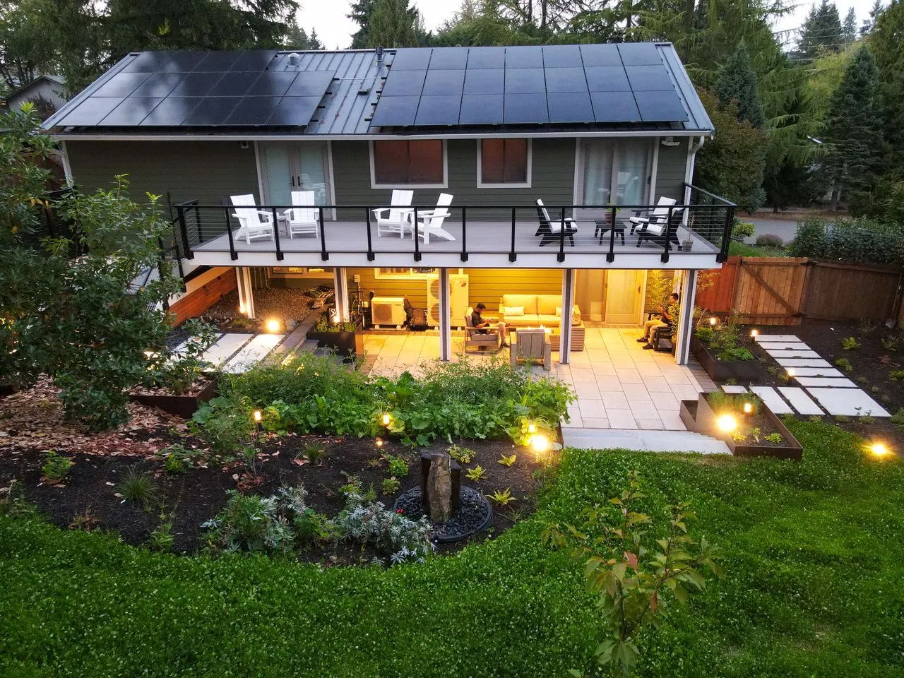 Backyard patio near a newly landscaped backyard with shrubs