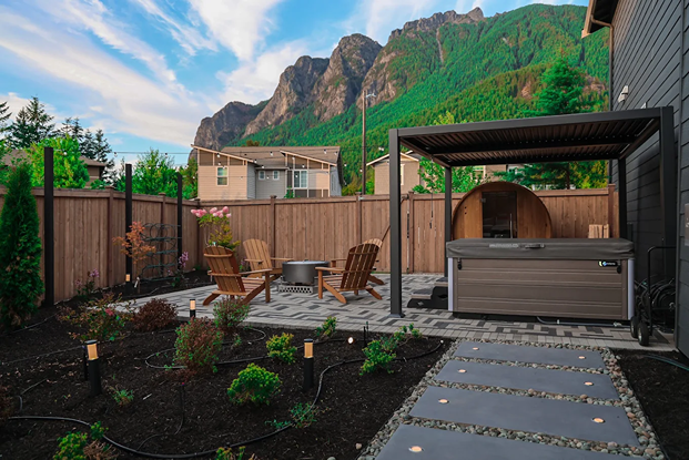 Seattle backyard with Adirondack chairs, and a pergola