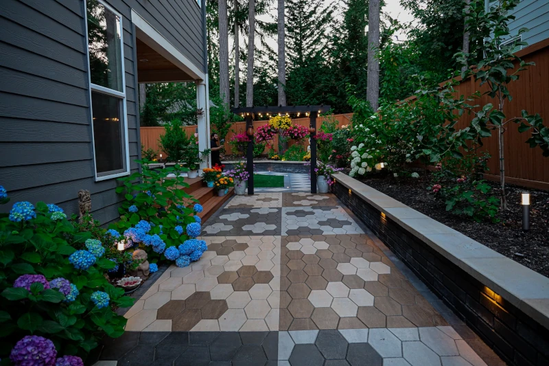 A  garden in a Seattle home that underwent custom hardscaping with lighting underneath plant