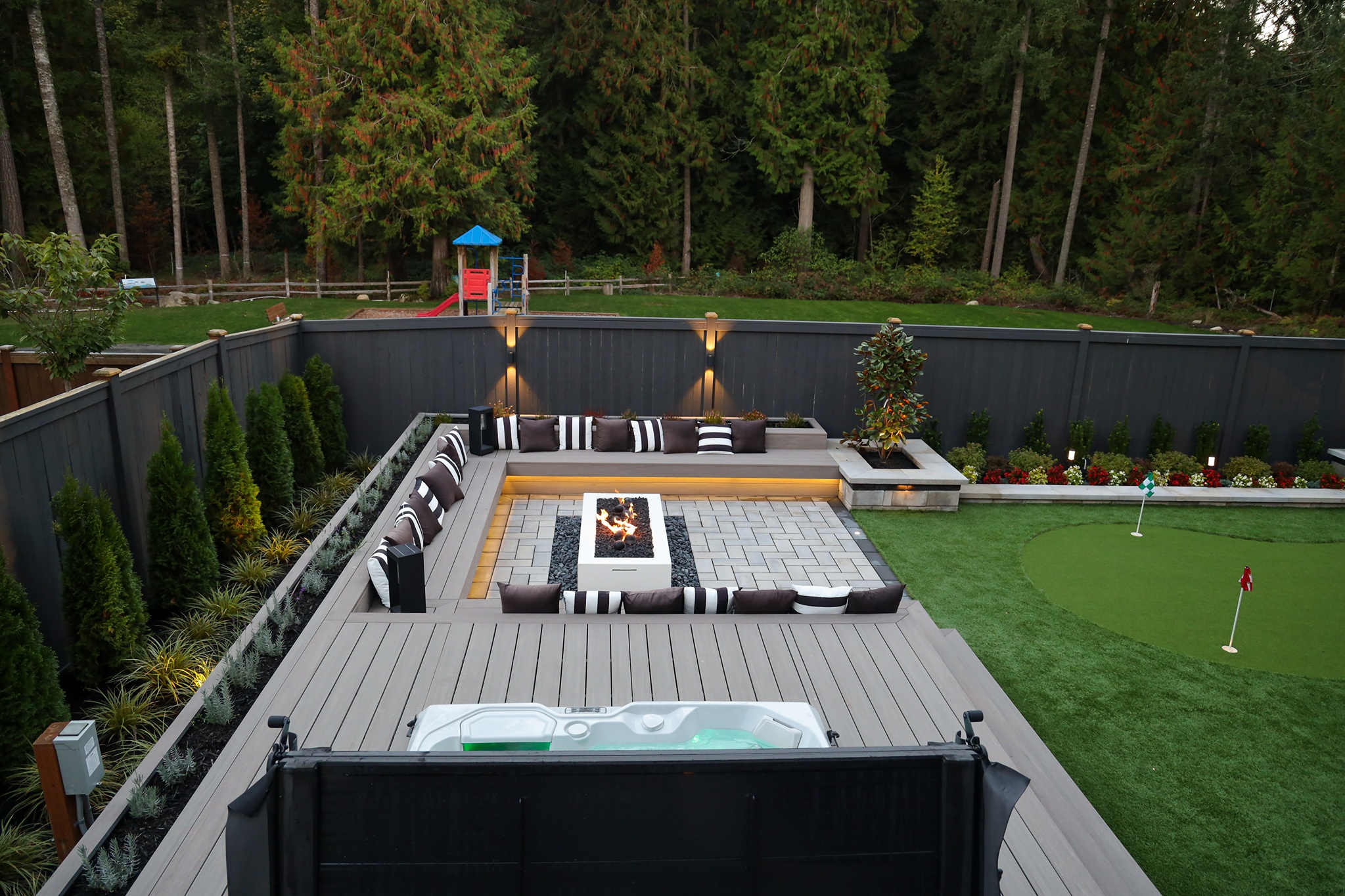 Outdoor living space transformation with wooden deck installed for hot tub in Redmond