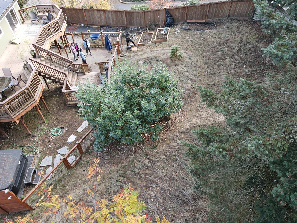 Backyard remodeling contractors in Bellevue inspecting a property for patio project