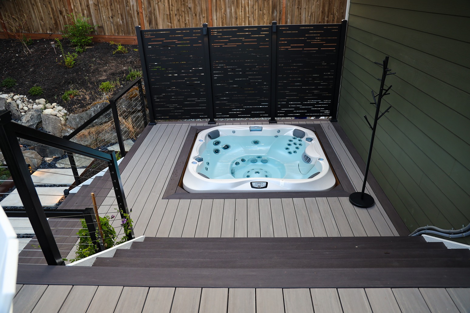 Hot tub in a backyard patio in Bellevue installed by remodeling contractors