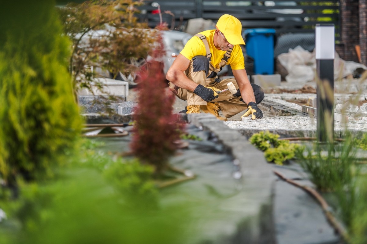 Landscape contractor building a hardscape feature on a Greater Seattle property