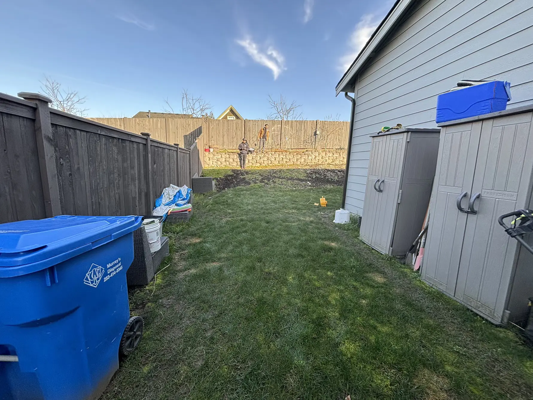 Sloped & Soggy Backyard Transformation Before