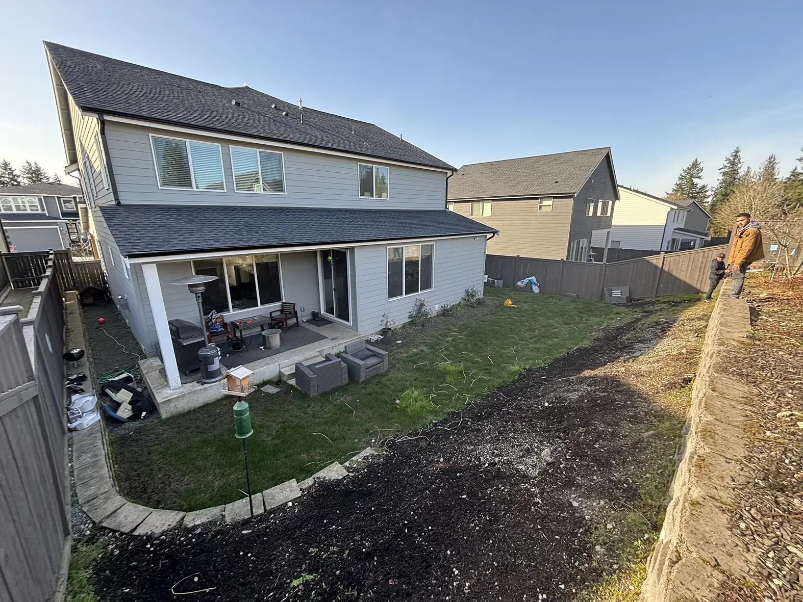 Sloped & Soggy Backyard Transformation Before