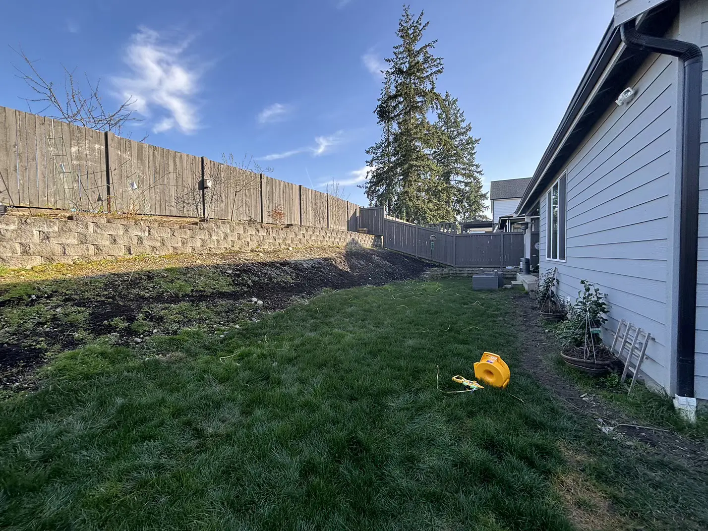 Sloped & Soggy Backyard Transformation Before Main