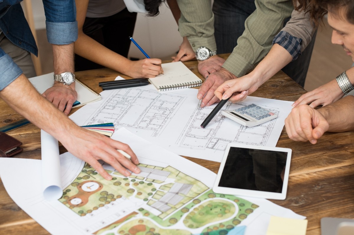 Landscape architect reviewing a Seattle backyard site plan