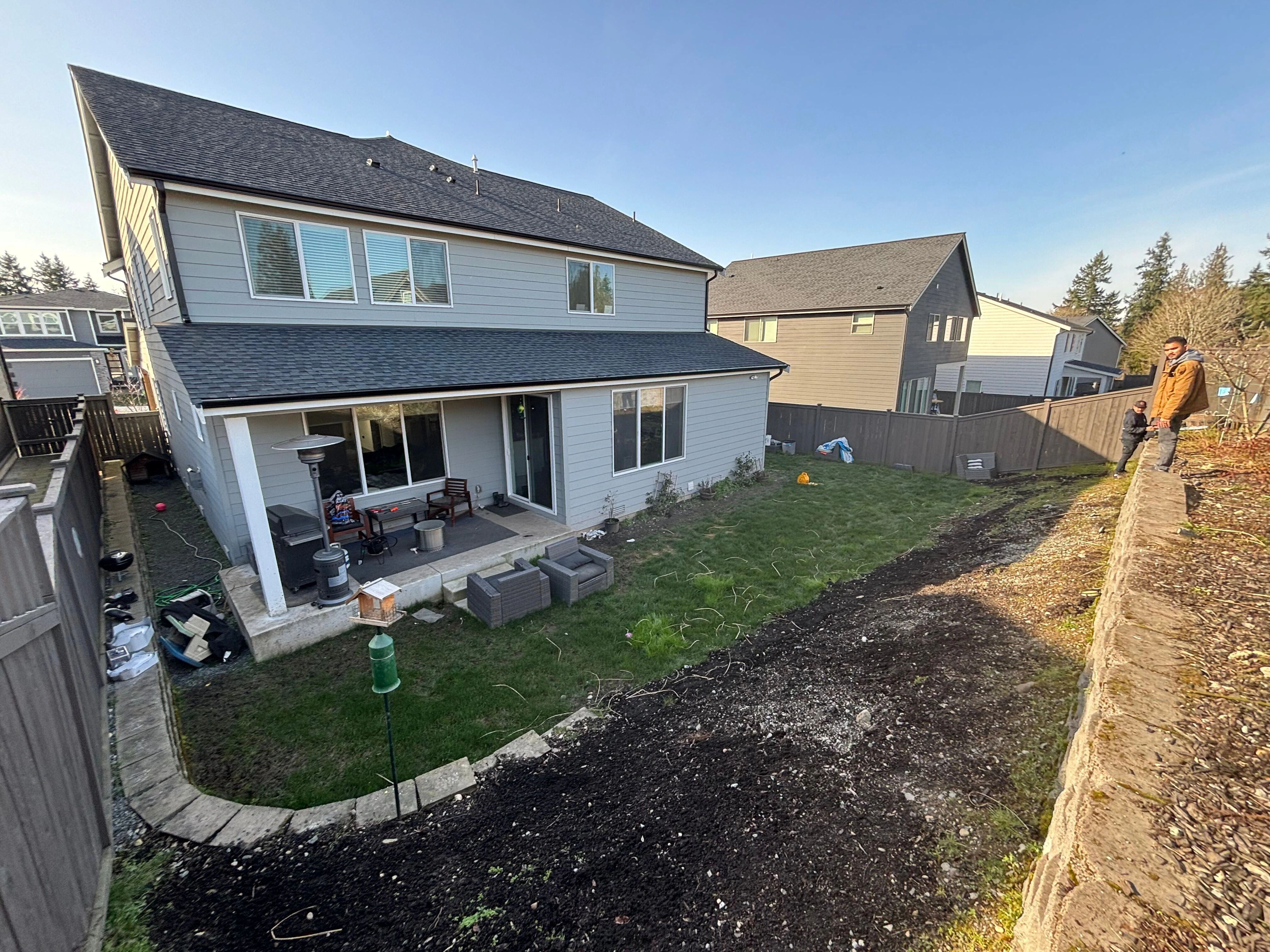 Before underused backyard in Sammamish WA awaiting landscape transformation