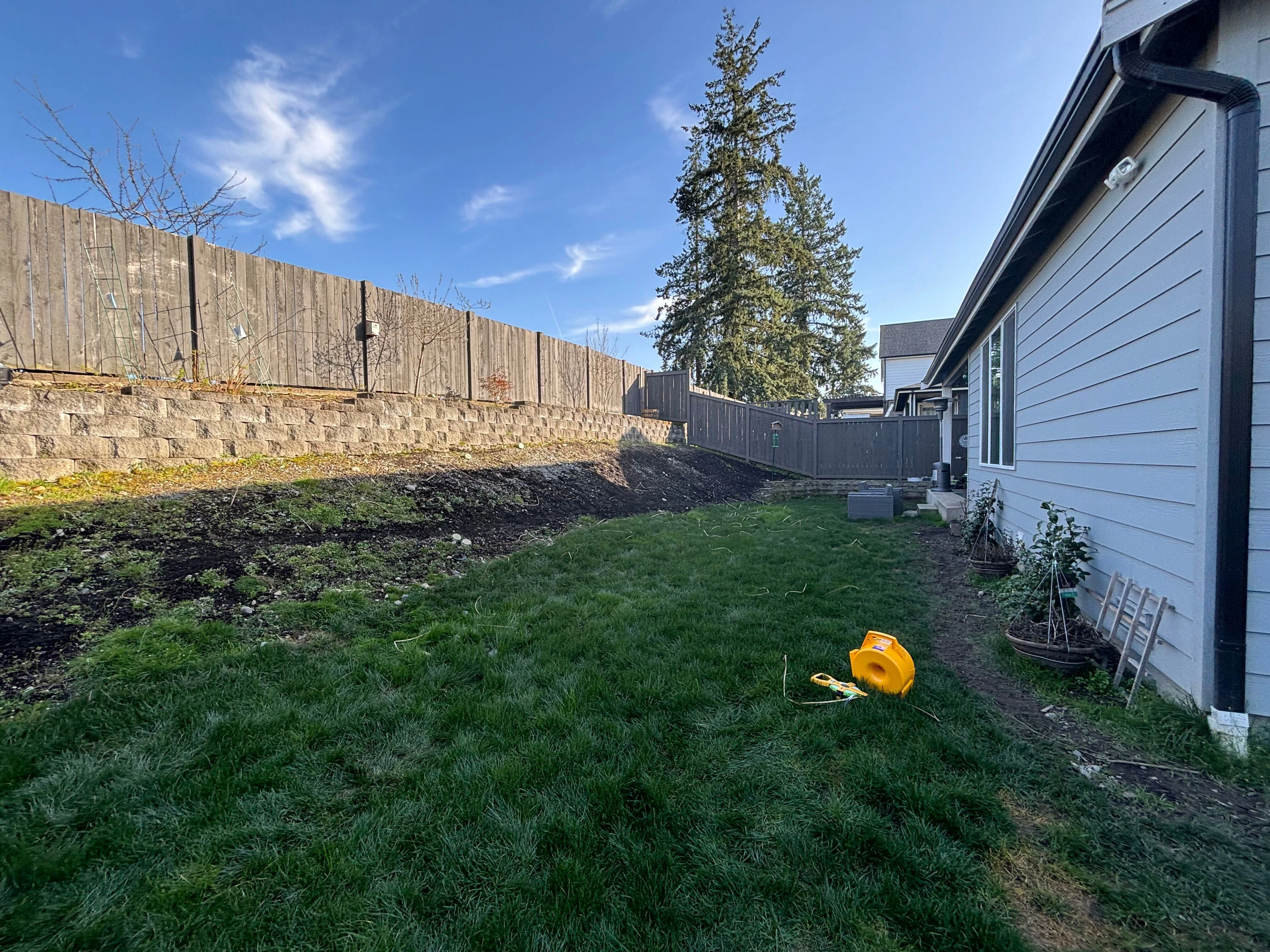 Before outdoor space in Sammamish before landscape company renovation project