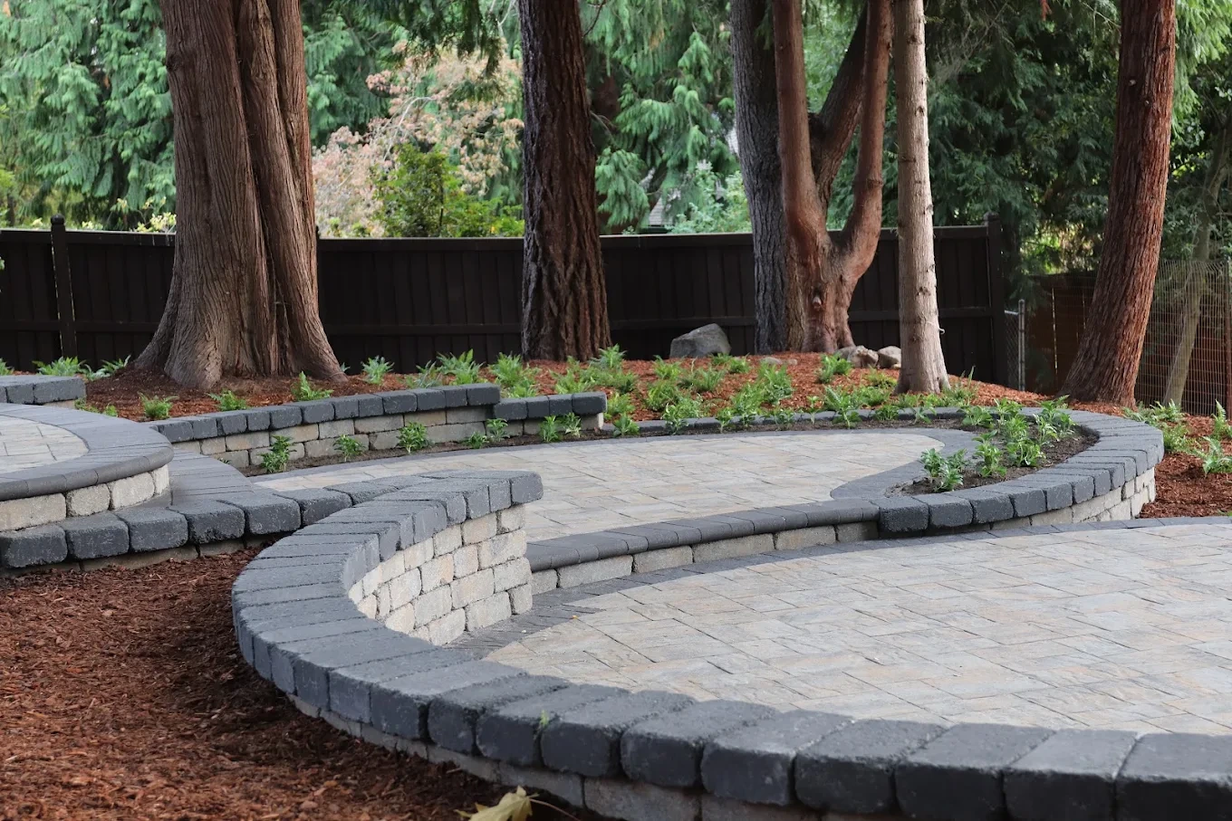 Custom hardscaping patio and retaining wall installation in Redmond Washington
