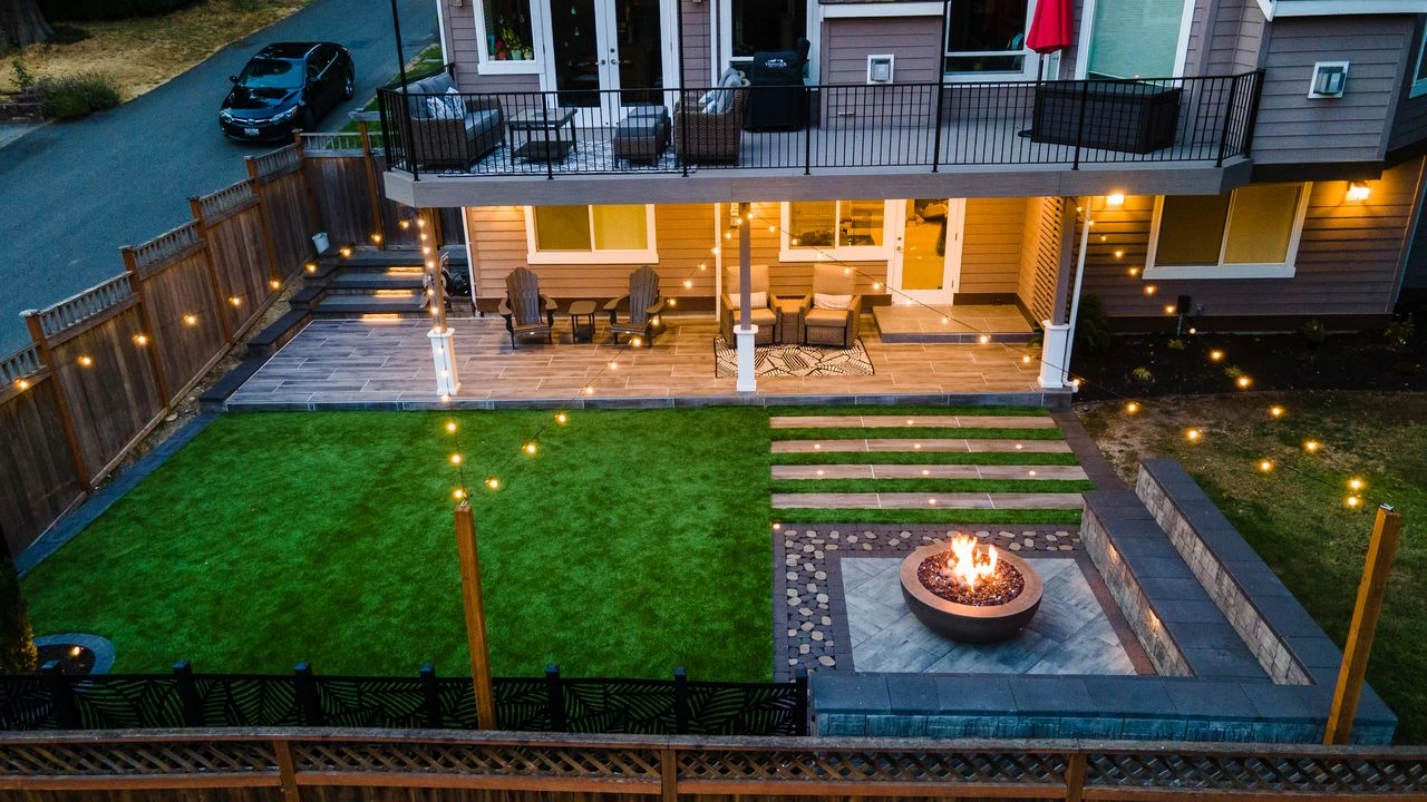 Fully landscaped yard with patio and mature plantings