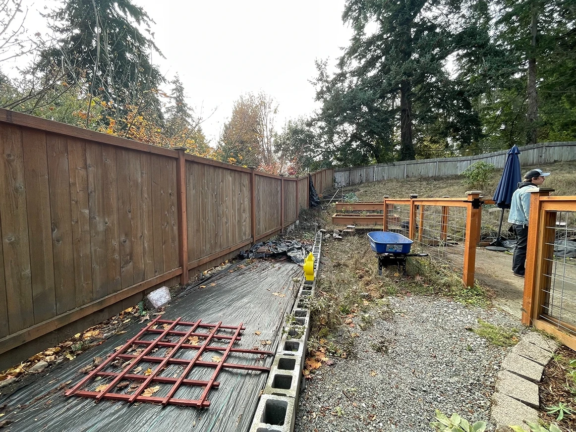 Phased construction timeline showing site preparation and hardscape installation progress on a Greater Seattle landscape project
