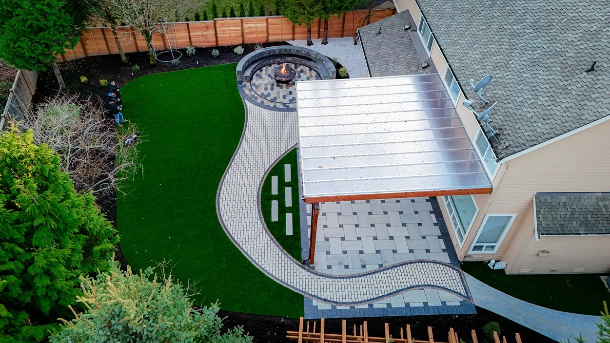 A Newcastle outdoor space with a retaining wall and outdoor seating area after renovation.