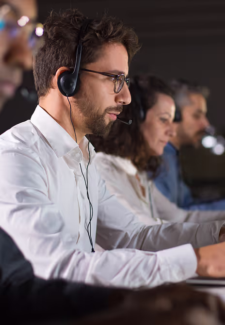 Confident call center operator talking to a customer