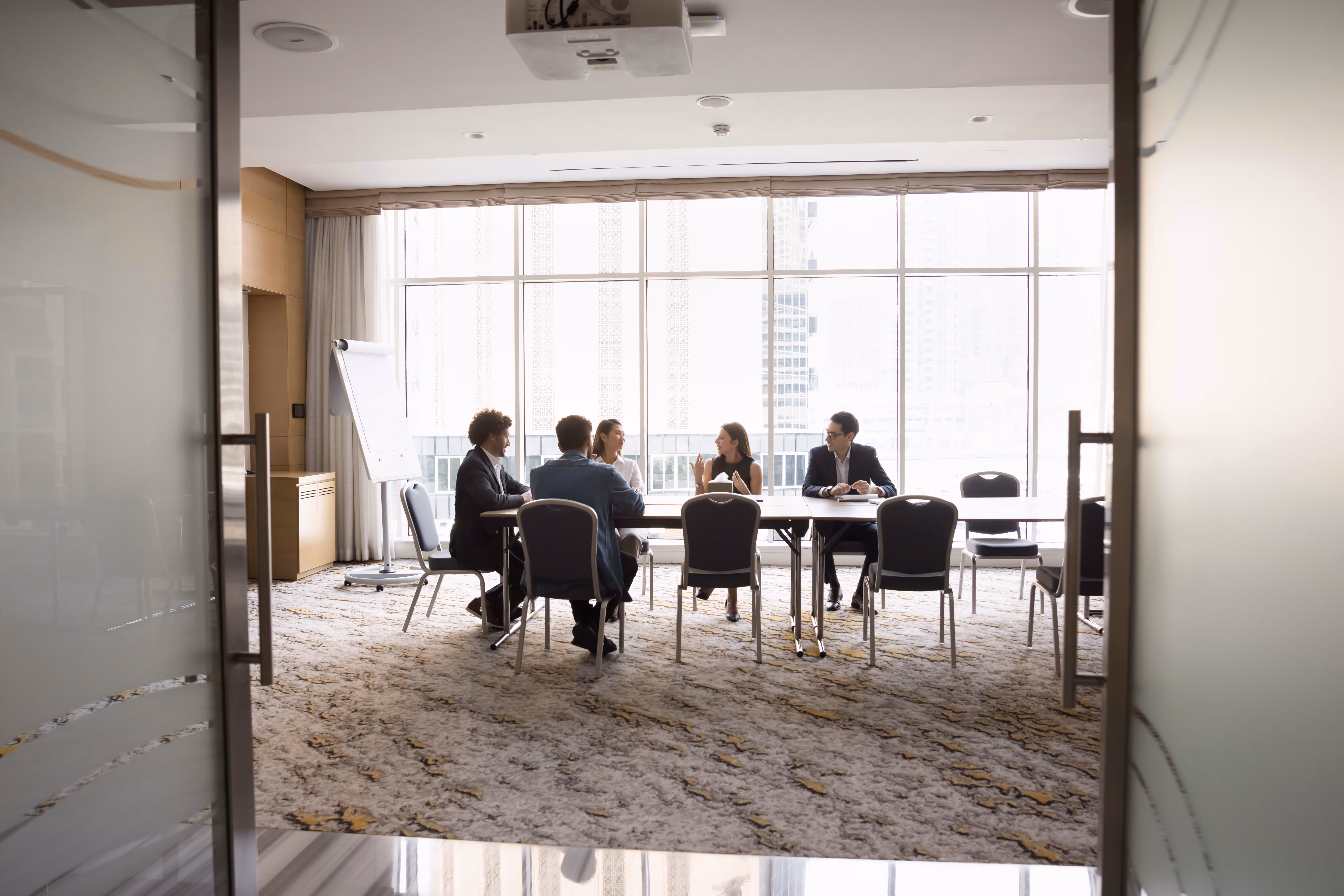 Healthcare professionals reviewing digital medical records together, emphasizing teamwork and data security.