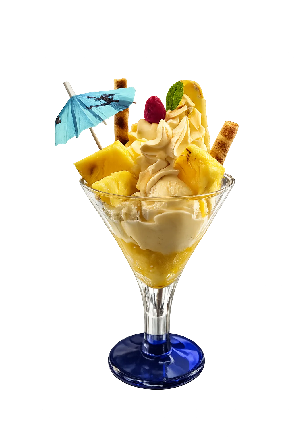 Tropical dessert in a glass with pineapple chunks, whipped cream, wafer rolls, mint, and a blue cocktail umbrella.