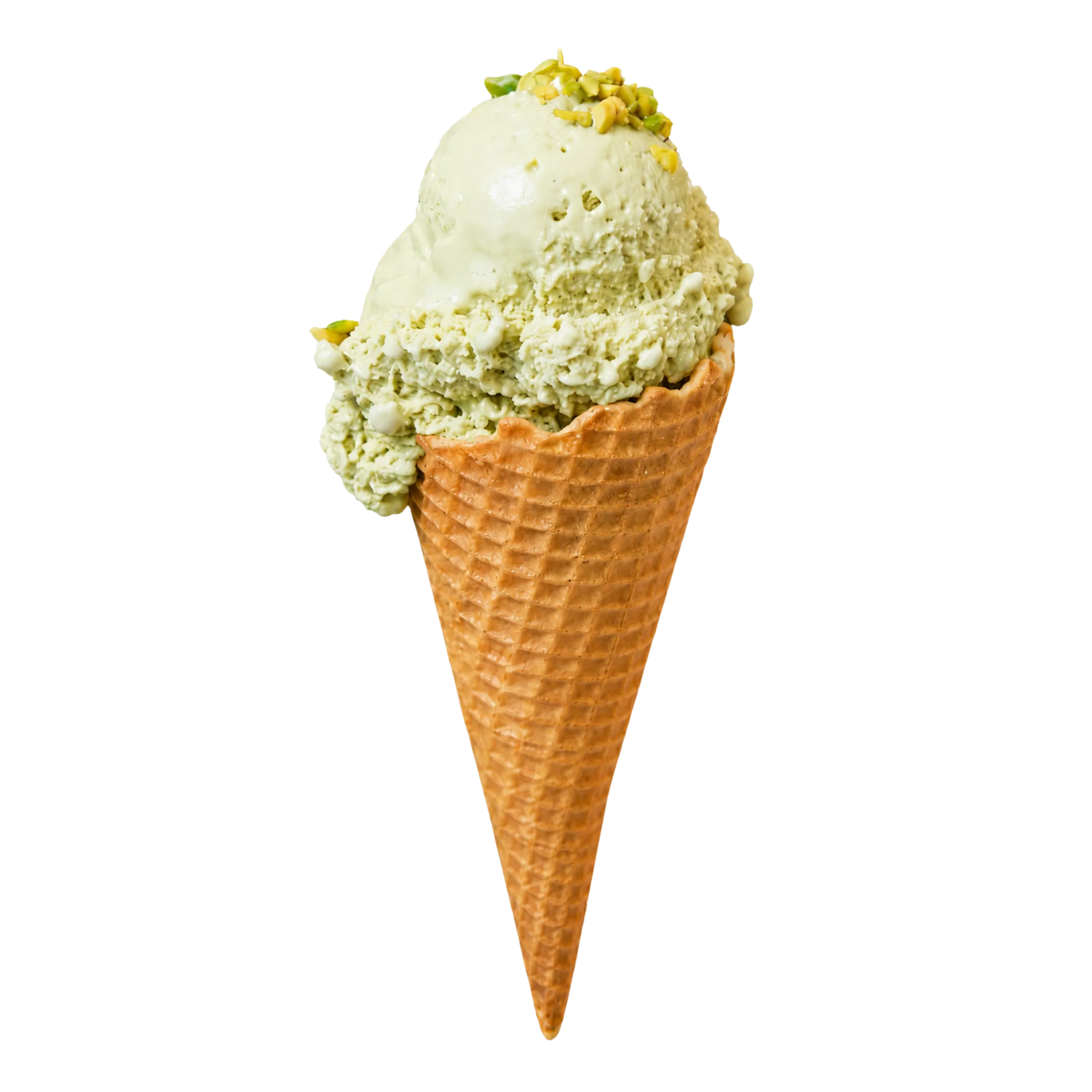 Pistachio ice cream scoop in a waffle cone topped with chopped pistachios.