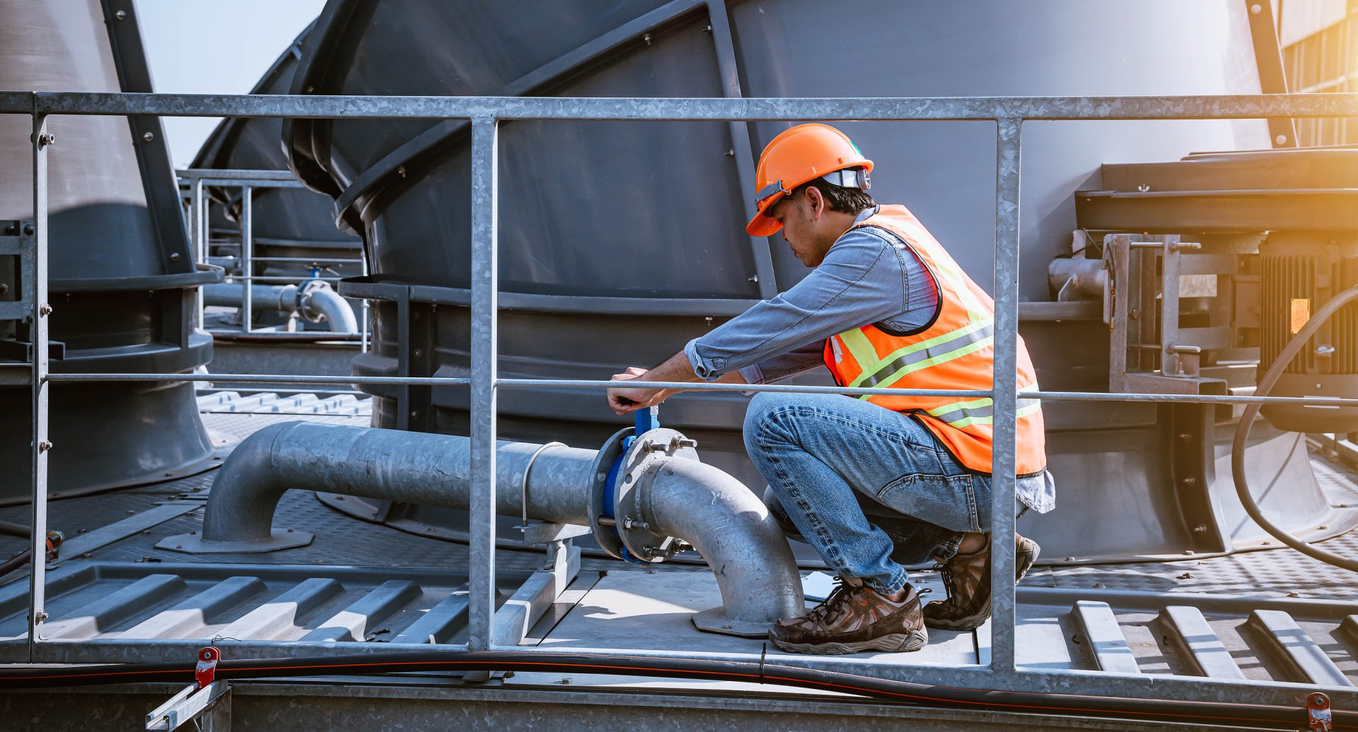 Worker turning valve on Engineered Pumps