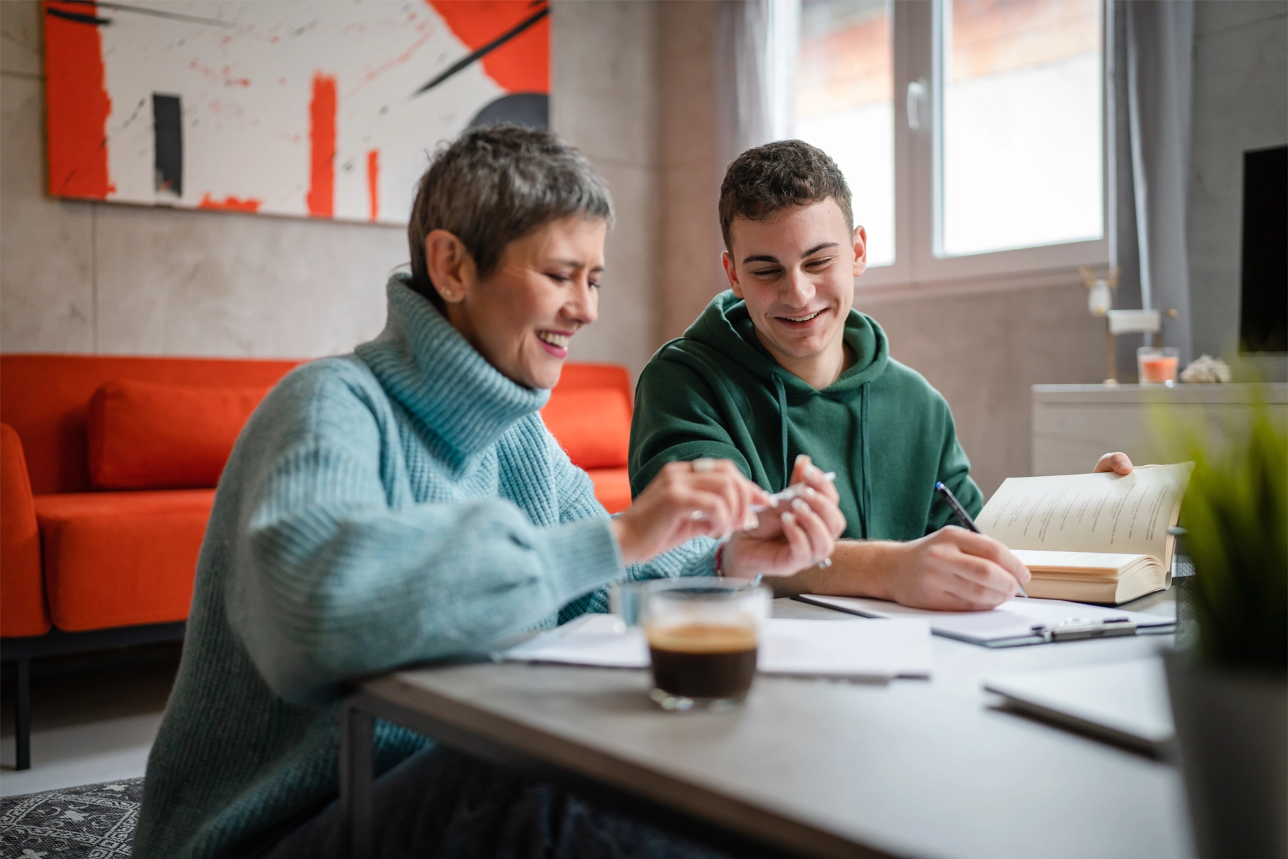 Two people sitting together studying
