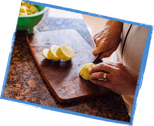 Hands slicing a lemon