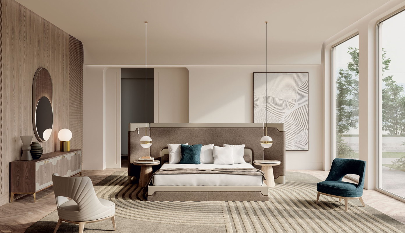 Modern bedroom with a large upholstered bed, curved chairs, round side tables, pendant lights, and a large window overlooking trees.