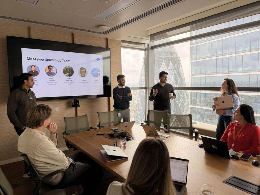 Customers reviewing agents together on a large screen