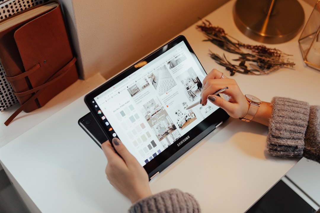 person browsing an architect's portfolio on a tablet - advertising architecture