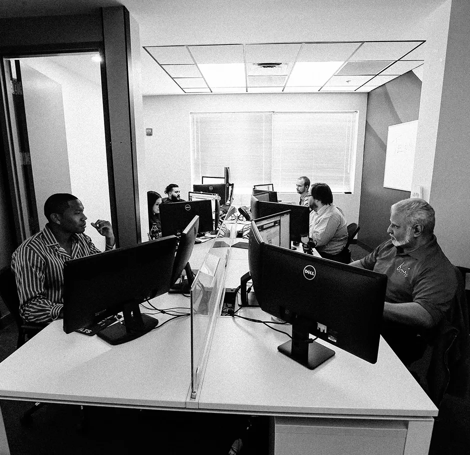 a team of people working on computers