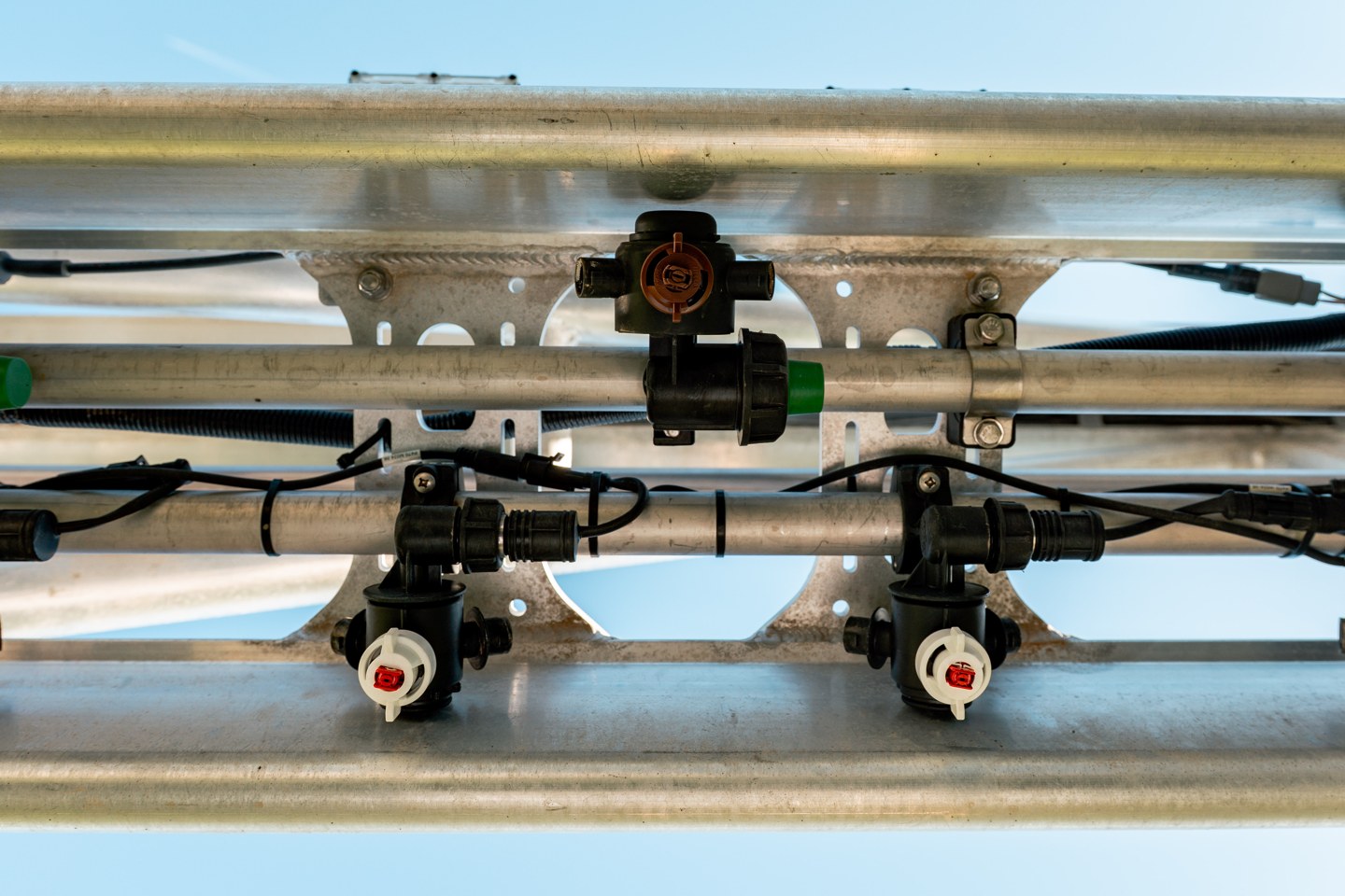 The targeted spraying line running parallel to the broadcast line under the Greeneye boom