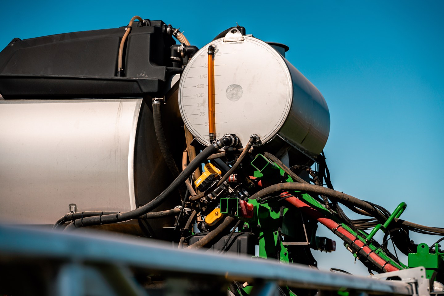 The dedicated second tank of the Greeneye system mounted on a sprayer