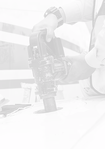 Person holding a fuel nozzle inserted into an aircraft fuel tank opening.