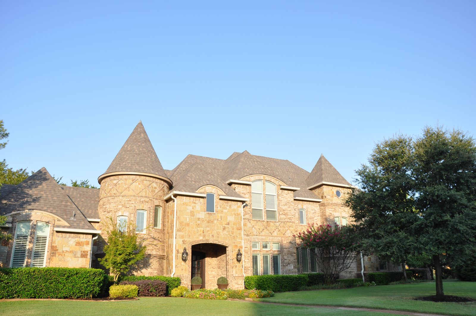 Luxury stone estate home with newly installed asphalt shingle roof in Southlake TX