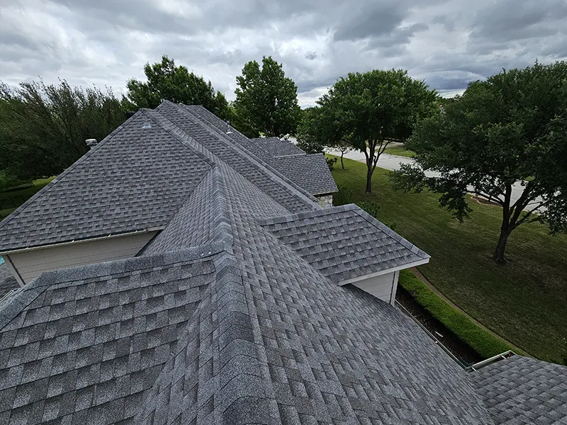 Newly installed gray shingle roofing on a residential home in Southlake, TX by CLC Roofing.
