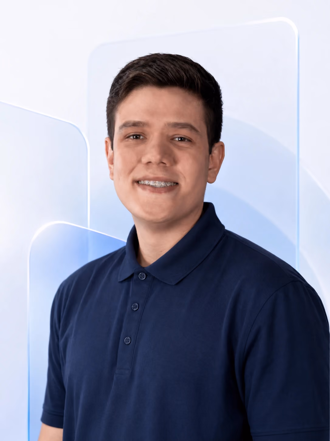 Professional Nimbus Media team profile portrait with a clean navy shirt, logo removed, and a soft pale blue glassmorphism background.