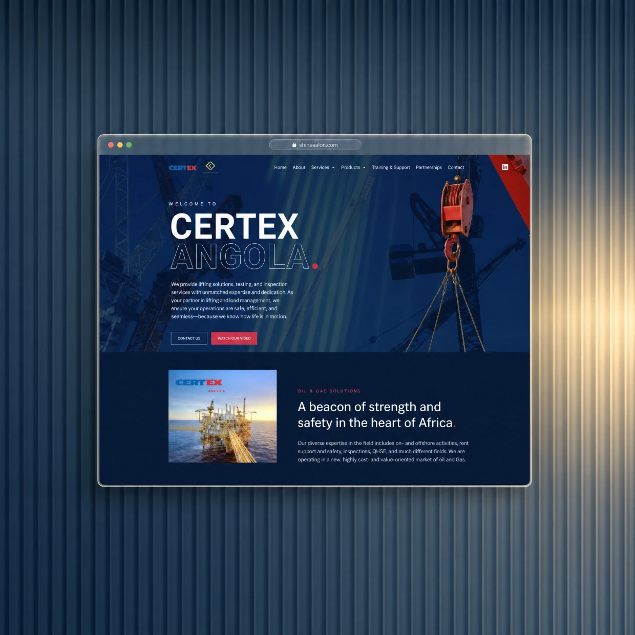 Oil and gas website in a glass browser window on a navy fluted glass background