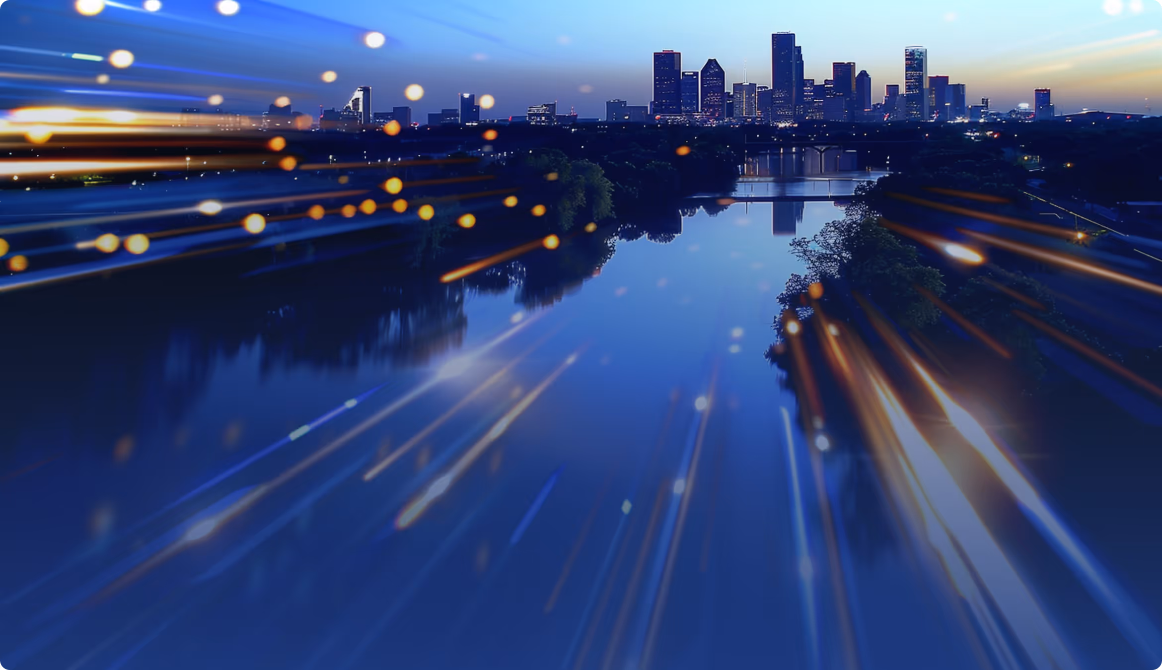 A city skyline at dusk reflected in still water, streaked with light trails