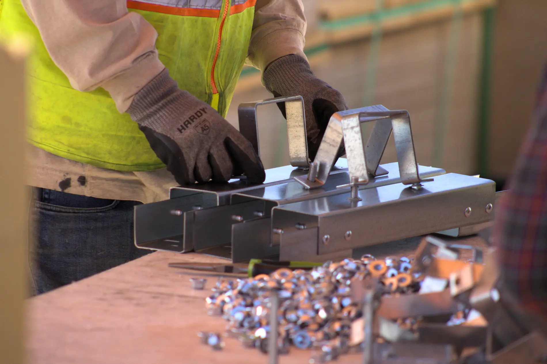 Crew member installing equipment on a job site