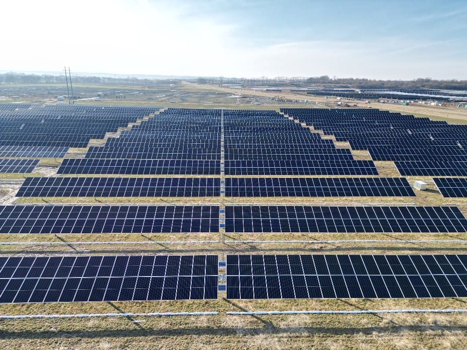 Aerial view of a large-scale solar field installed by Power Work Force